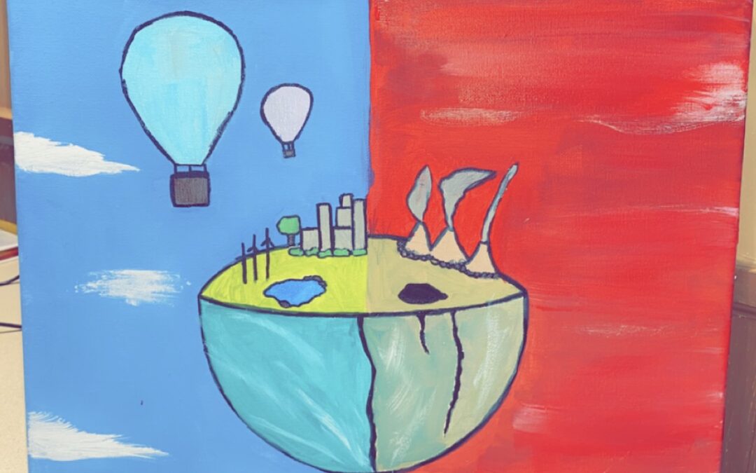 students painting of the earth split in two. One side with a blue cloudy background with hot air balloon's in the sky. this side of the planet also has windmills and trees, the water is clean. the opposite side has a red smokey background with dirty water and exhaust from power plants filling the sky.