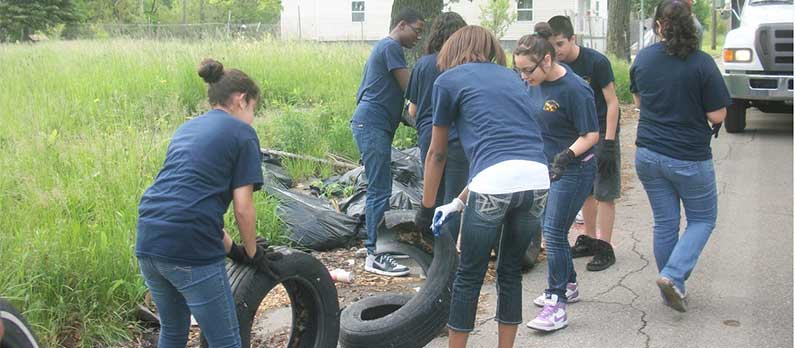 Student tire clean-up project at Hope of Detroit